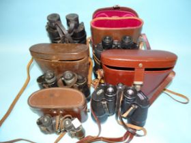 A collection of five pairs of binoculars: Barr & Stroud 7x CF41, serial no.54305, (no case), Kershaw