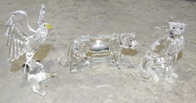 Swarovski, "Cheetah Seated", (boxed), together with two unboxed animal figures, "Tiger" and "Bald