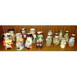 A collection of Royal Doulton small Toby jugs, including "Town Crier", "The Jester" and "The Clown",