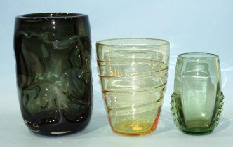 A Whitefriars heavy dimple green glass vase, 23cm high, (scratched) and other pieces of