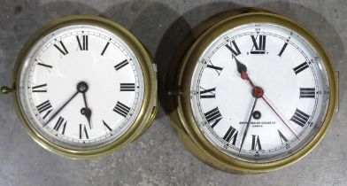 A brass bulkhead clock, the circular enamel dial signed Smiths English Clocks Ltd, 24cm diameter and