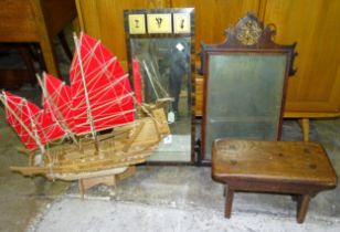 A Georgian walnut-framed wall mirror, 70 x 41cm, a wooden model of a junk, 60 x 65cm, a foot stool