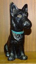 A SylvaC black-glazed Scottie dog stamped 1208, with painted eyes and collar, 22cm high.