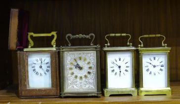 Two French brass carriage timepieces, both with cracked dials, movements operate, one in carrying