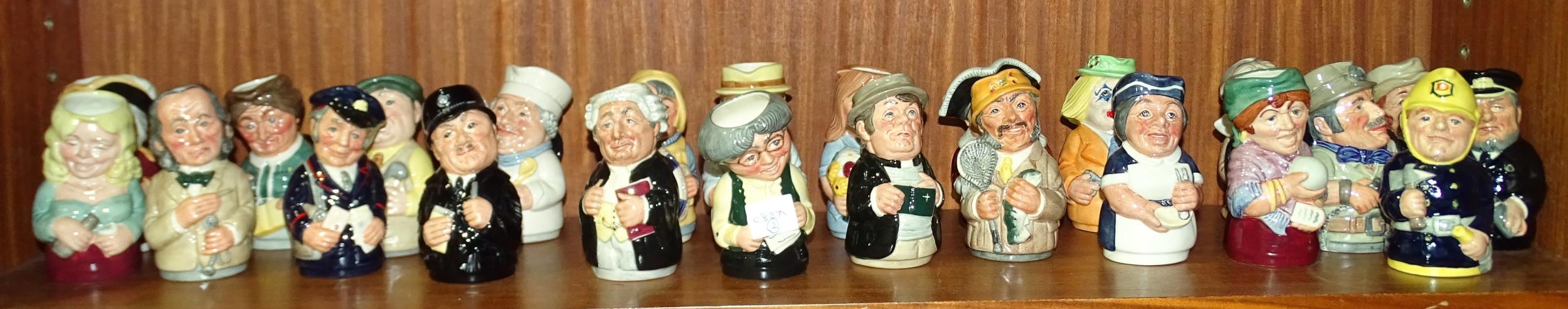 A collection of Royal Doulton small character jugs, "The Doultonville Collection", including "Miss
