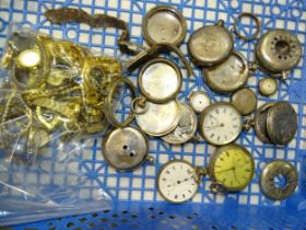 Various silver watch cases, some with movements.