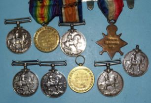 Nine WWI medals: 1914-15 Star, (name removed), British War (x7, one name removed) and Victory (x2).