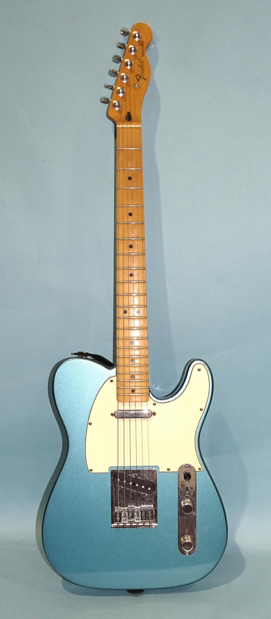 A similar guitar, made in Mexico, with blue and cream body, no.MZ9368219.
