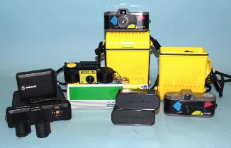 A Minox EC sub-miniature camera with flash unit, in pouch, two Minolta 16 film cartridges, two "Le