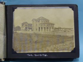 An early-20th century album of twenty-two 12 x 16cm photographs of a hospital, staff and surrounding