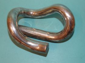 A silver-plated Pandrol railway track clip.