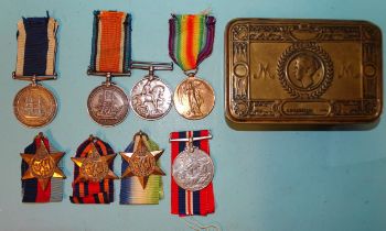 A family group: a VR Long Service and Good Conduct Medal awarded to J Burke P.O. 1Cl HMS Vivid and