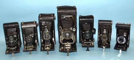 Seven pocket folding cameras, including four Kodak Autographic, two with cases.