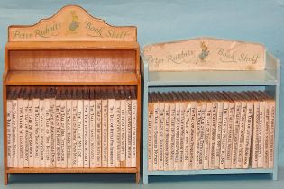Potter (Beatrix), a complete set of volumes c1950's on 'Peter Rabbit's' bookshelf and another set,