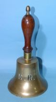 A Highland Railway station hand bell impressed H.R., with turned wood handle, 33cm.