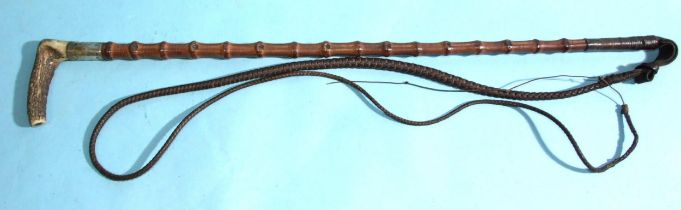 A flexible bamboo hunting whip with antler handle, silver collar and plaited lash, shaft 69cm,