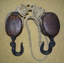A large wooden pulley, "To lift 14/19CWT".
