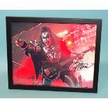 Gene Simmons, bassist/vocalist with the rock band Kiss, a signed coloured photograph 19.5 x 24.