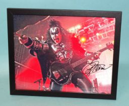 Gene Simmons, bassist/vocalist with the rock band Kiss, a signed coloured photograph 19.5 x 24.