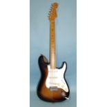 A Fender Stratocaster with original contoured body, made in Mexico, (with synchronised tremolo),