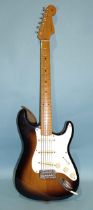 A Fender Stratocaster with original contoured body, made in Mexico, (with synchronised tremolo),