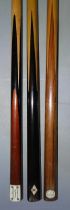 A collection of three snooker cues: a MacMorran Tom Newman cue, 18oz, 58'', a Burroughes/Watts