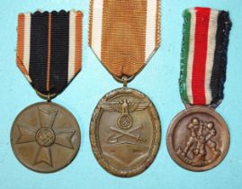 Three German WWII medals: African Campaign, West Wall and Merit, (3).