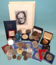 A small collection of Elizabeth II commemorative crowns, a 1935 crown, a plated National