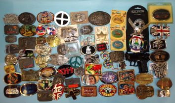 A large quantity of belt buckles, many relating to cinema and tv.