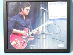 Noel Gallagher, a signed coloured photograph, 19 x 24cm, with Autograph certificate of