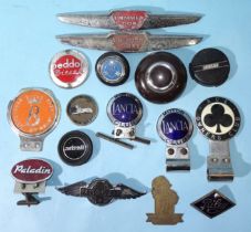 Various car badges, including Lancia Ace Owner's Club, Bessacarr Owner's Club and others.