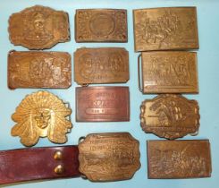 A Western-style belt buckle on leather belt marked "Gaylord", another, (no belt) and eight other