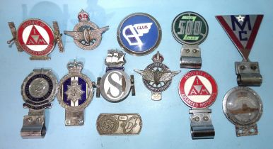 A group of vintage car badges including The 500 Club, IAW, Order of Knights of the Road, Civil