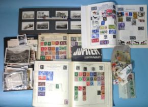 A small quantity of stamps in four albums and loose and a small quantity of ephemera.