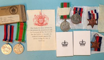 A WWII pair of medals, Defence and 1939-45 War Medal, with certificate and box of issue addressed to