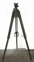 A wood and brass heavy-duty tripod, painted khaki, with levels and turning mechanism, 160cm long