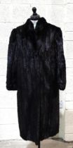A black mink full-length coat with stand-up collar and cuffed sleeves, no maker's label, size 12