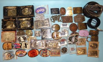 A large quantity of brass and other buckles and belts, many relating to cinema and tv.