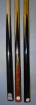 A collection of three snooker cues: a Thurston Special Royal ash/ebony handmade cue, 15oz, 57½'',