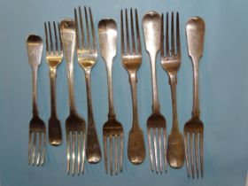 Four George IV silver fiddle pattern table forks, London 1829, maker William Chawner II, three other