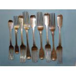Four George IV silver fiddle pattern table forks, London 1829, maker William Chawner II, three other