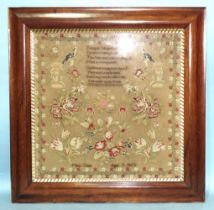 A large mid-Victorian needlework sampler worked a morbid rhyme surrounded by sprays of flowers,