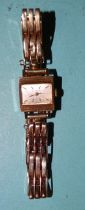 Buren, a lady's 1960's 9ct gold square-cased wrist watch on 9ct gold expanding bracelet,