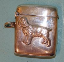 An Edwardian silver Vesta case of plain rectangular form, one side with applied profile of a spaniel