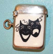 An Edwardian silver Vesta case of small plain form, one side enamelled with black 'Comedy' and '