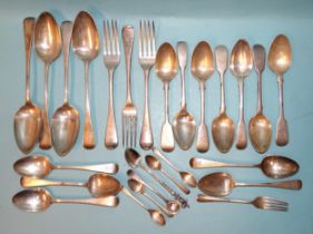 A quantity of 19th century silver flatware, including four tablespoons, twelve dessert spoons, three