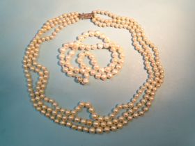 A necklace of three strings of graduated cultured pearls, 4.5mm - 8mm with marcasite set silver