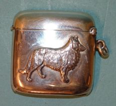 An Edwardian silver Vesta case of plain rounded square form, one side with applied profile of a