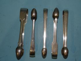 Five pairs of Georgian plain silver sugar tongs, various dates, ___6oz.