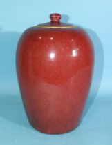 A large Chinese flambé-glazed jar and cover, (chipping to base and cover), late Qing, 30cm high.